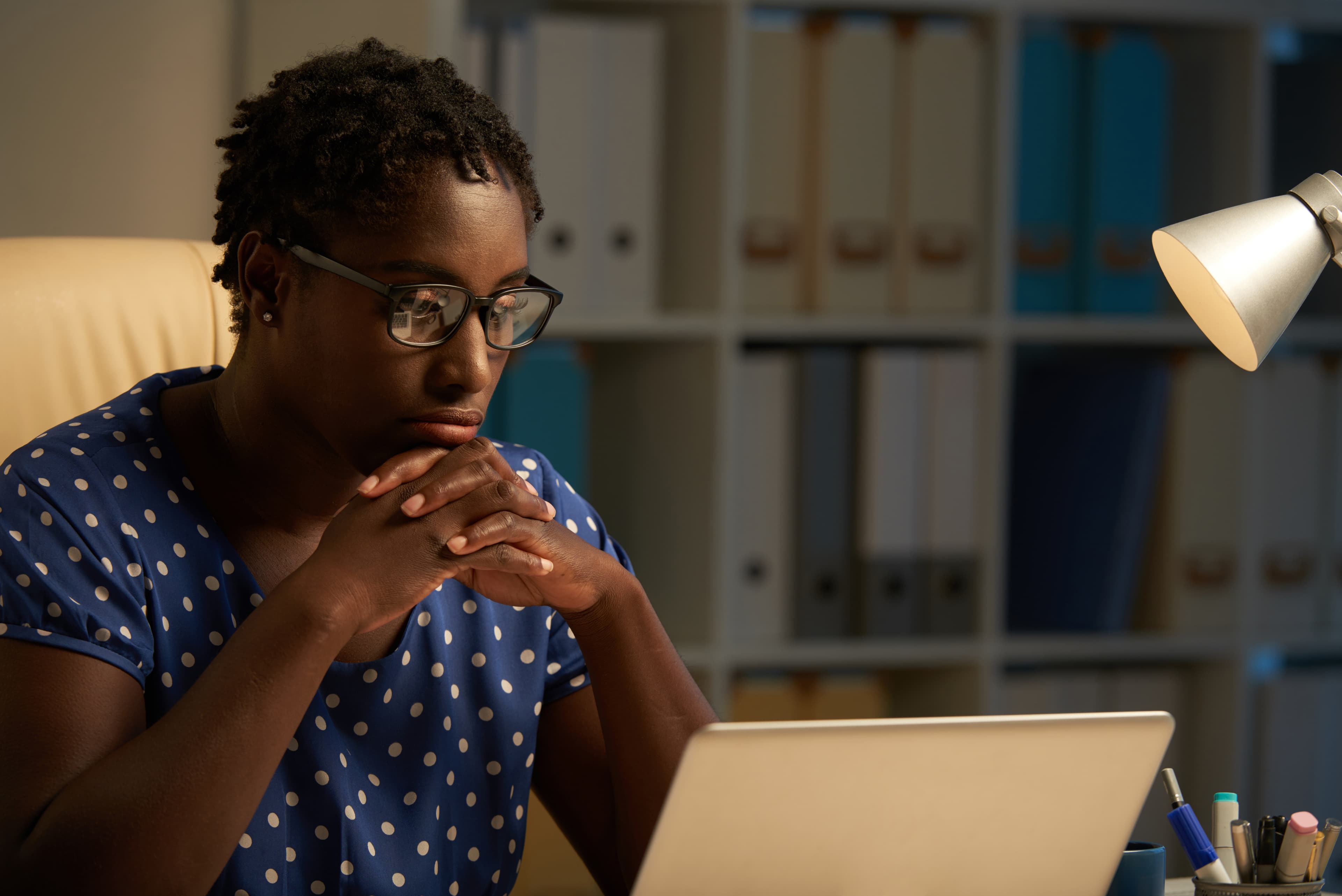Person studying on laptop at night
